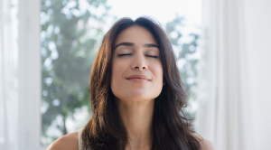 Breathing for mental and physical wellbeing; woman relaxing